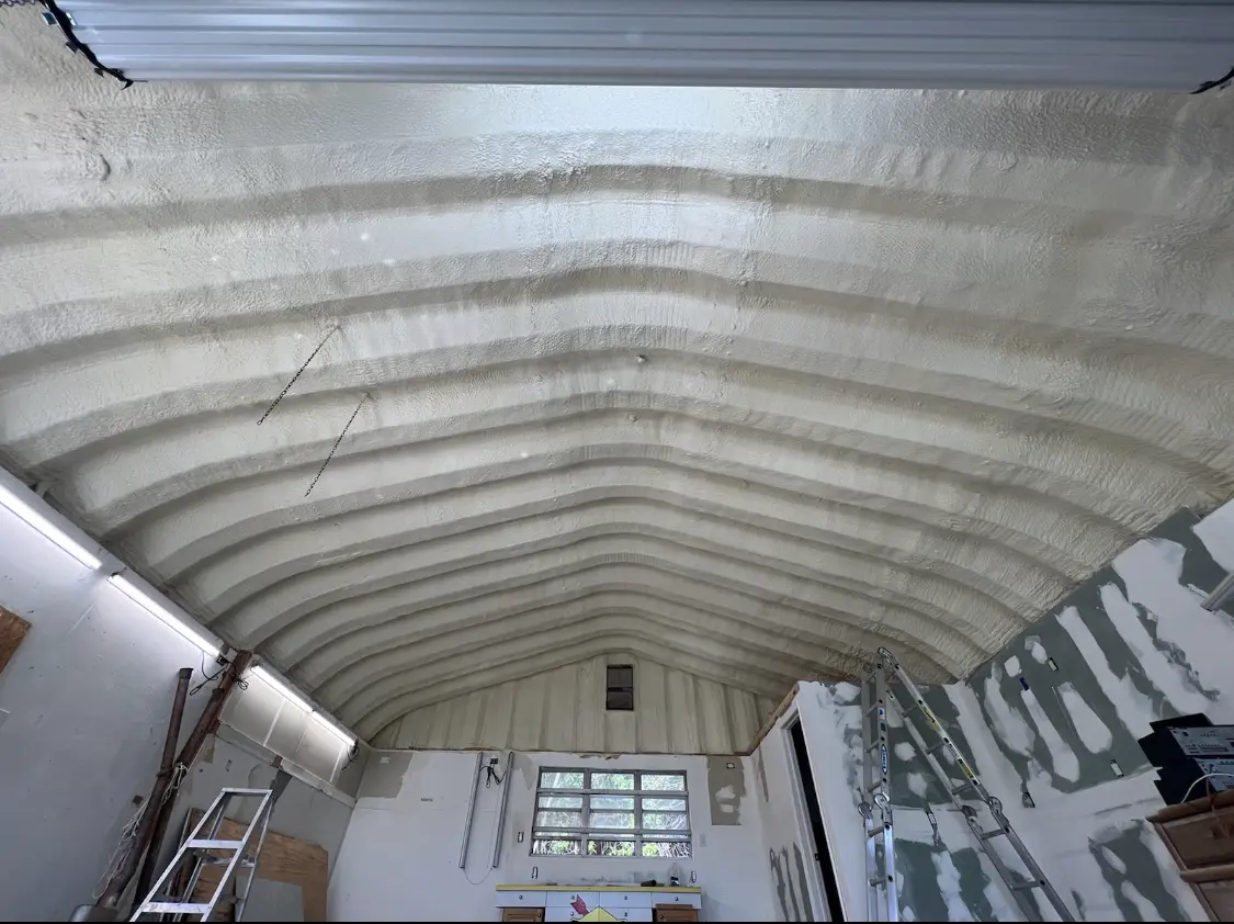 Spray polyurethane foam applied to the underside of a metal roof deck in Shaler